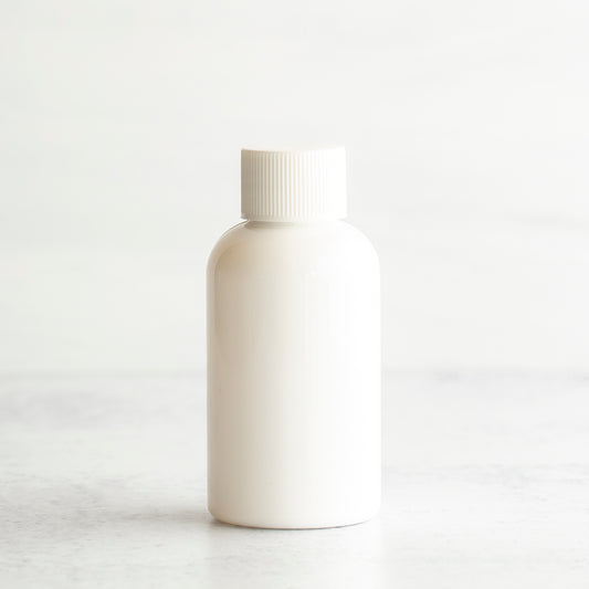 2 oz White PET Boston Round Bottle with 20-410 White Ribbed Cap