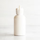 2 oz White PET Boston Round Bottle with 20-410 White Turret Cap