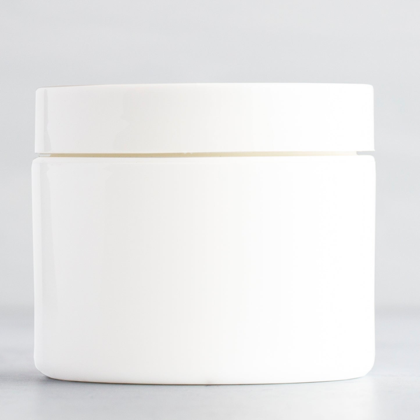 2 oz White Square Base Plastic Jar with White Gloss Flat Cap