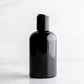 4 oz Black PET Boston Round Bottle with 20-410 Black Disc Cap