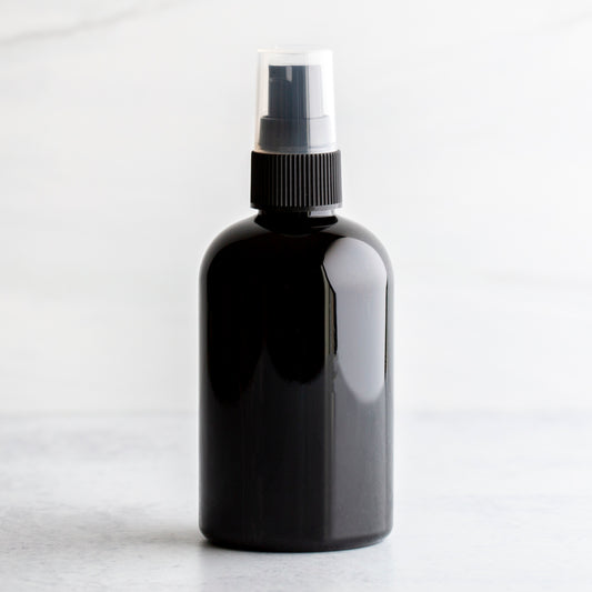 4 oz Black PET Boston Round Bottle with 20-410 Black Treatment Pump