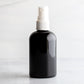 4 oz Black PET Boston Round Bottle with 20-410 White Fine Mist Sprayer