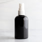 4 oz Black PET Boston Round Bottle with 20-410 White Fine Mist Sprayer