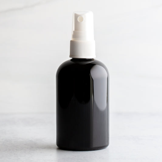 4 oz Black PET Boston Round Bottle with 20-410 White Fine Mist Sprayer