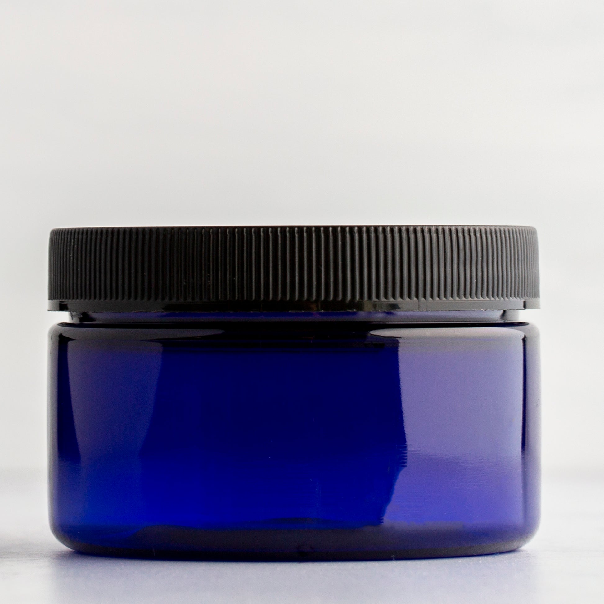 4 oz Blue Shallow Plastic Jar with Black Ribbed Cap