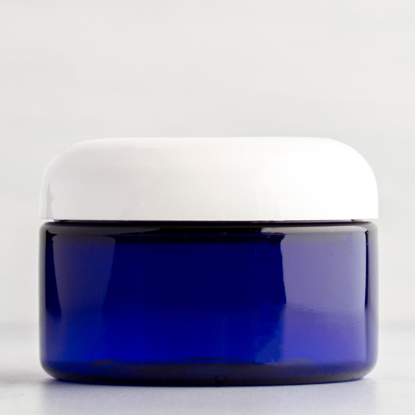 4 oz Blue Shallow Plastic Jar with White Dome Cap