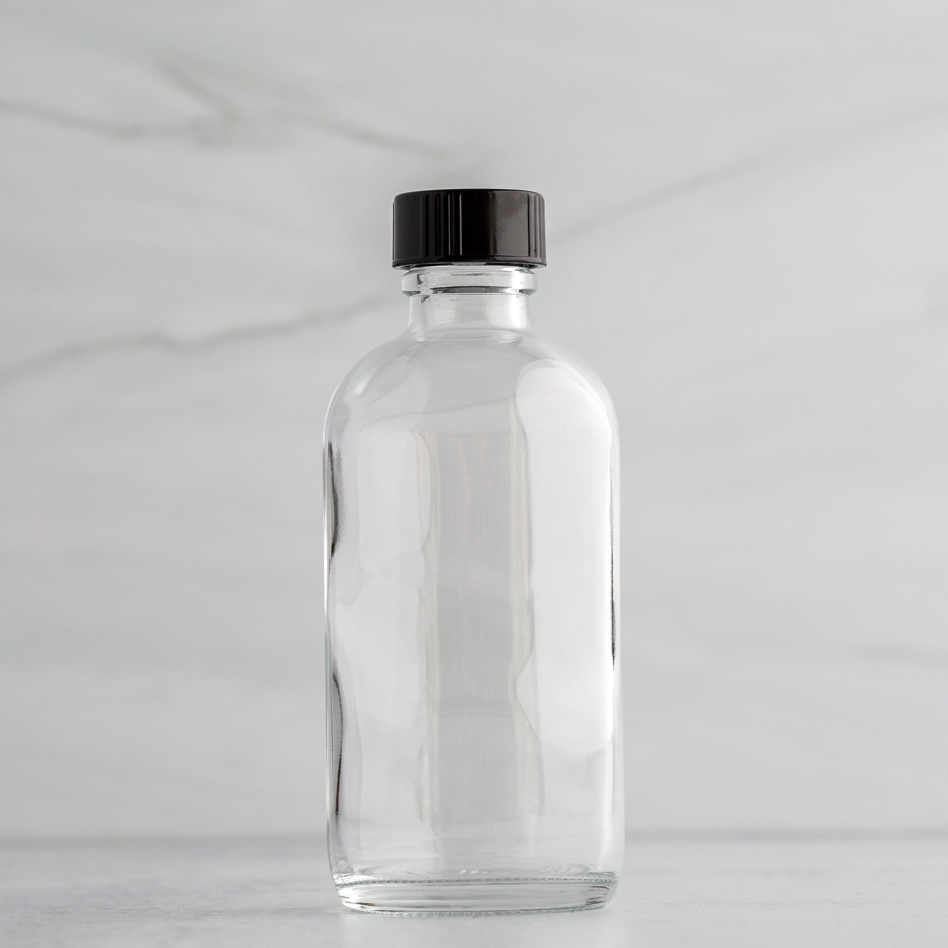 4 oz Clear Glass Bottle with Black Phenolic Cap
