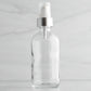 4 oz Clear Glass Bottle with White Treatment Pump with Brushed Aluminum Shell