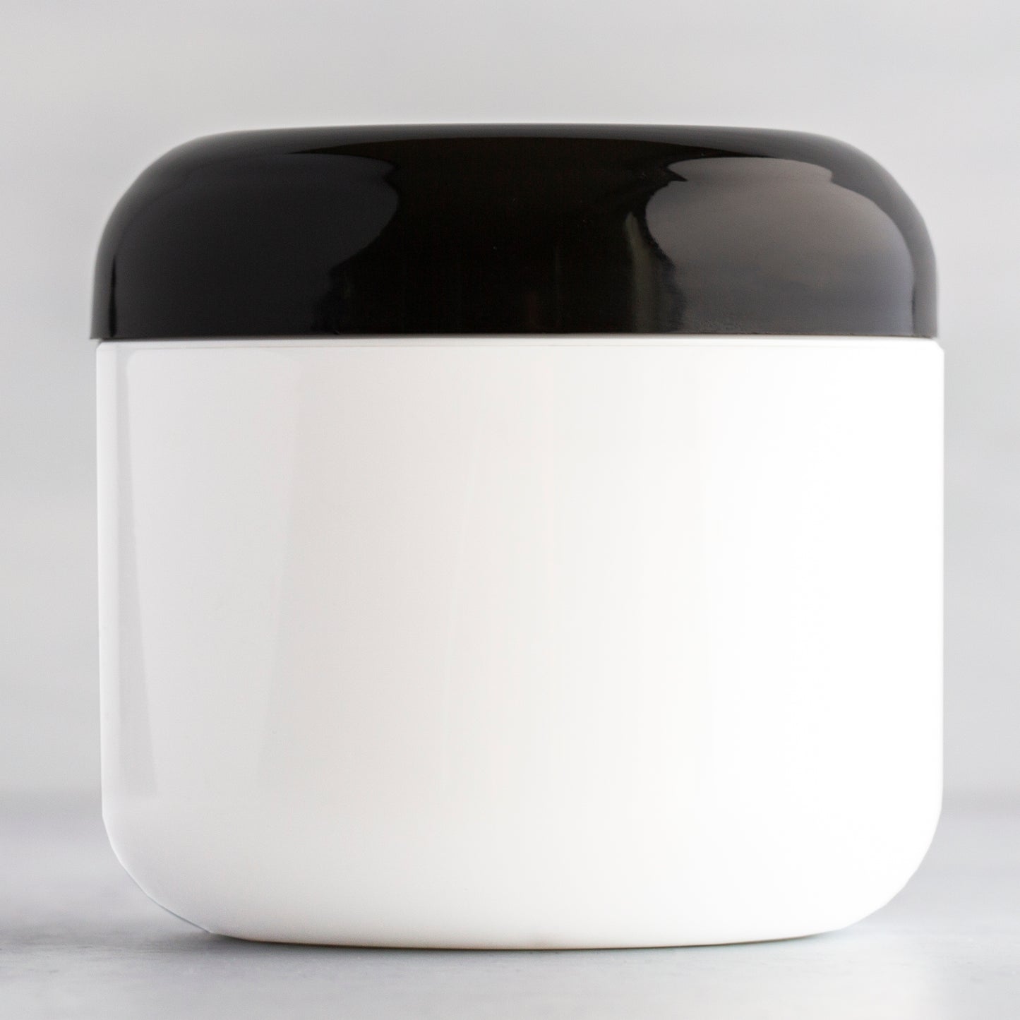 4 oz White Round Base Plastic Jar with Black Dome Cap