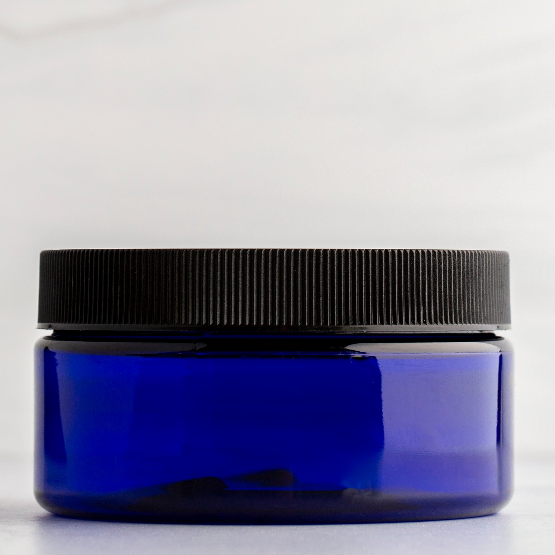 8 oz Blue Shallow Plastic Jar with Black Ribbed Cap