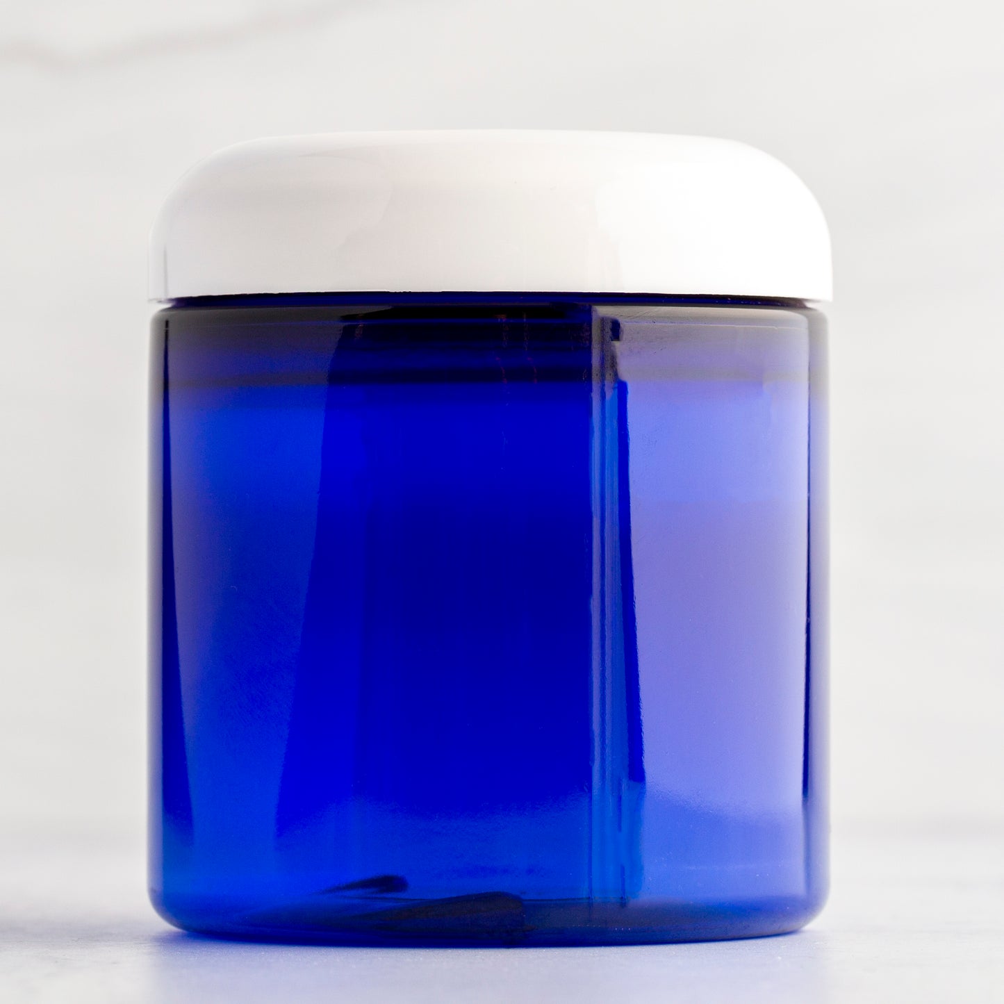 8 oz Blue Straight Side Plastic Jar with White Dome Cap