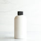 8 oz White PET Boston Round Bottle with 24-410 Black Ribbed Cap