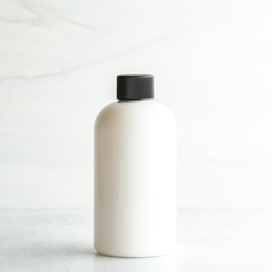 8 oz White PET Boston Round Bottle with 24-410 Black Ribbed Cap