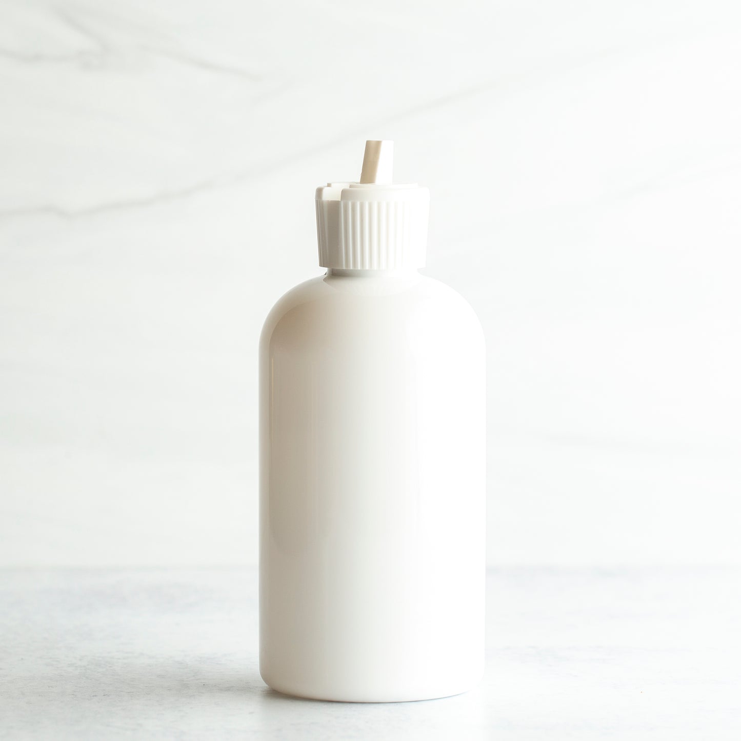 8 oz White PET Boston Round Bottle with 24-410 White Turret Cap
