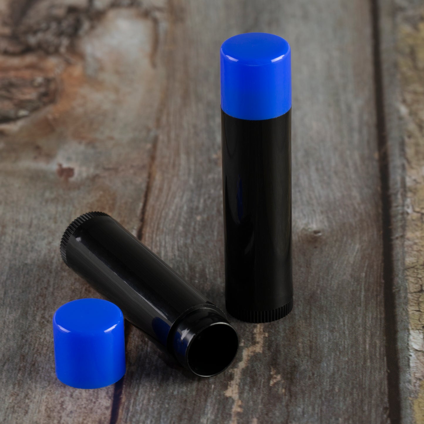 black lip balm tube blue cap