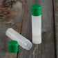 natural lip balm tube green cap