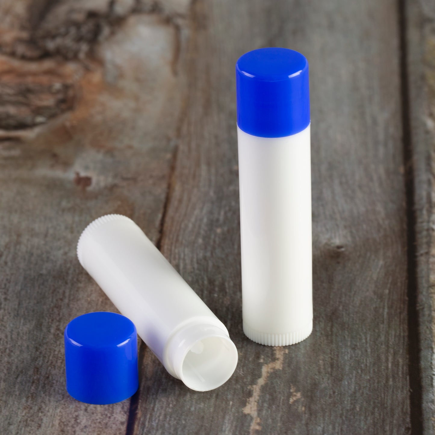 white lip balm tube blue cap