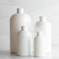 8 oz White PET Boston Round Bottle with 24-410 White Turret Cap